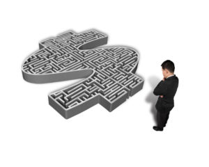 Thoughtful Businessman Facing 3D Money Symbol Maze