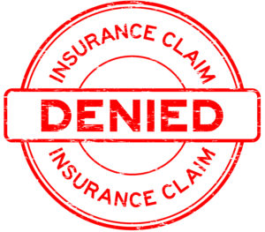 Grunge red insurance claim denied round rubber seal stamp