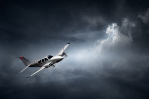 Aeroplane flying in storm with lightning (Concept of risk - digi