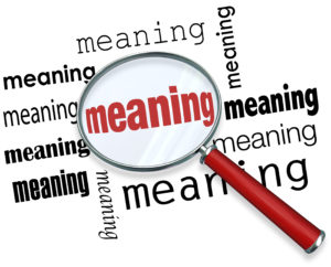 Meaning word under a magnifying glass to illustrate looking for,