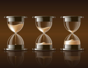 Sand falling in the hourglass.