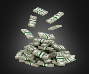 Stack Of Money American Dollar Bills Falling Into A Pile On Blac