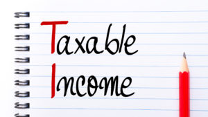 Ti Taxable Income Written On Notebook Page