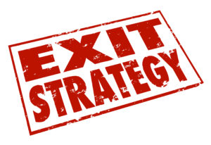 Exit Strategy words stamped in red ink giving a way out or escape from a contract, agreement or partnership
